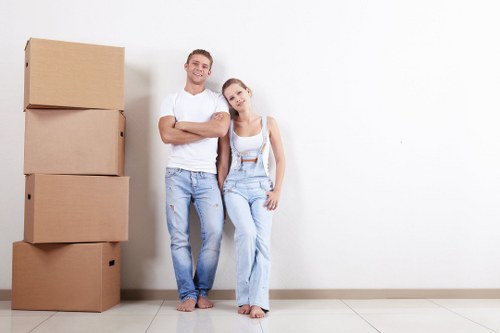 Local removals team working on a Fulham residential move with boxes and furniture