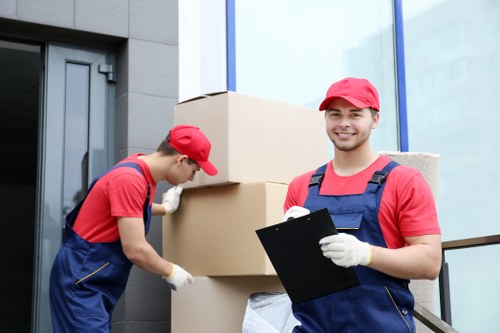 Removal company unloading items at a Fulham property entrance
