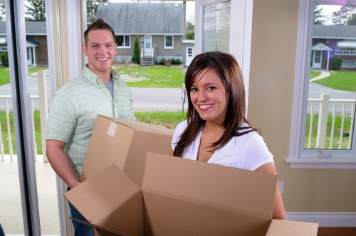 Packed boxes and furniture ready for a local house relocation in Fulham