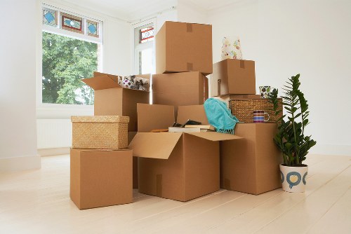 Packed moving boxes ready for a flat removal in Fulham