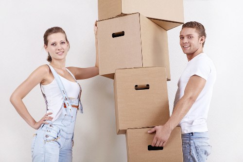 Mover carrying boxes near Fulham residential flats