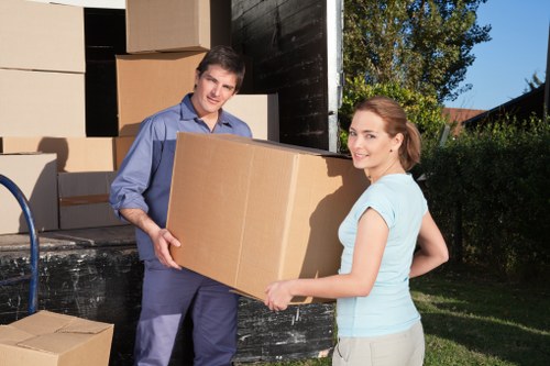 Trained movers handling furniture with care